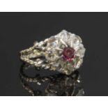 An Edwardian garnet and diamond circular cluster,