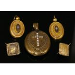 A Victorian gold oval hinged locket,