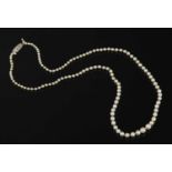 A cased single row graduated natural and cultured pearl necklace,