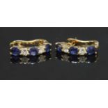 A pair of 18ct gold sapphire and diamond half hoop earrings,