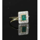 An emerald and diamond rectangular cluster ring,