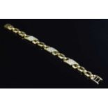 A gold geometric link diamond set bracelet,