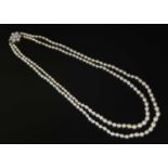 A two row graduated natural saltwater pearl necklace,
