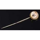 A Victorian gold reverse painted intaglio stick pin,