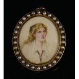 A painted oval miniature pendant,