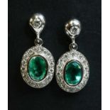 A pair of 18ct white gold emerald and diamond cluster drop earrings,