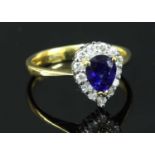 A gold sapphire and diamond cluster ring,