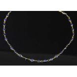 A gold sapphire rivière necklace,