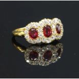 An Edwardian ruby and diamond triple cluster ring, c.1900,