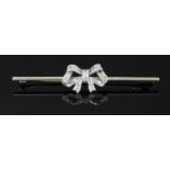 A white gold diamond set bow brooch, c.1925,