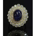 An 18ct gold sapphire and diamond oval cluster ring,