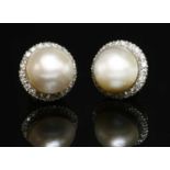 A pair of 18ct white gold mabé pearl and diamond circular cluster earrings,