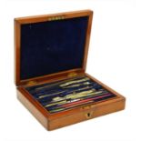 An early 20th century mahogany cased set of drawing instruments,