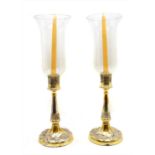 A pair of silver plated candlesticks,