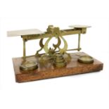 A large set of Sampson Mordan and Co brass postal scales and weights,