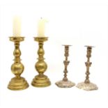 A pair of brass pricket candlesticks,