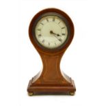 An Edwardian strung and inlaid mahogany balloon mantel clock,