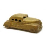 A 1940s brass novelty paint box,