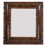 An oyster-veneered walnut cushion-framed wall mirror,