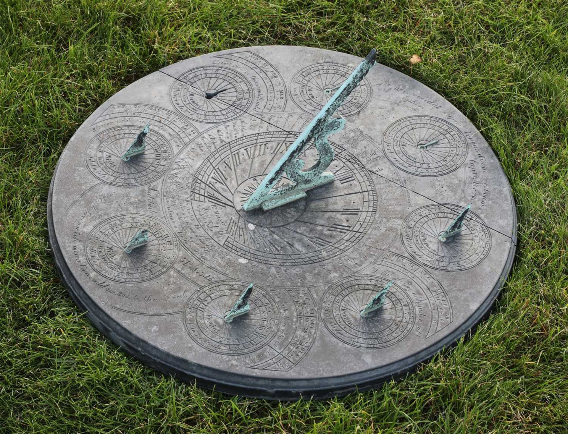 A rare circular slate sundial by Richard Melvin,