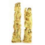 Two Japanese carved ivory figure groups,