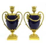 A pair of gilt bronze and porcelain cassolettes,