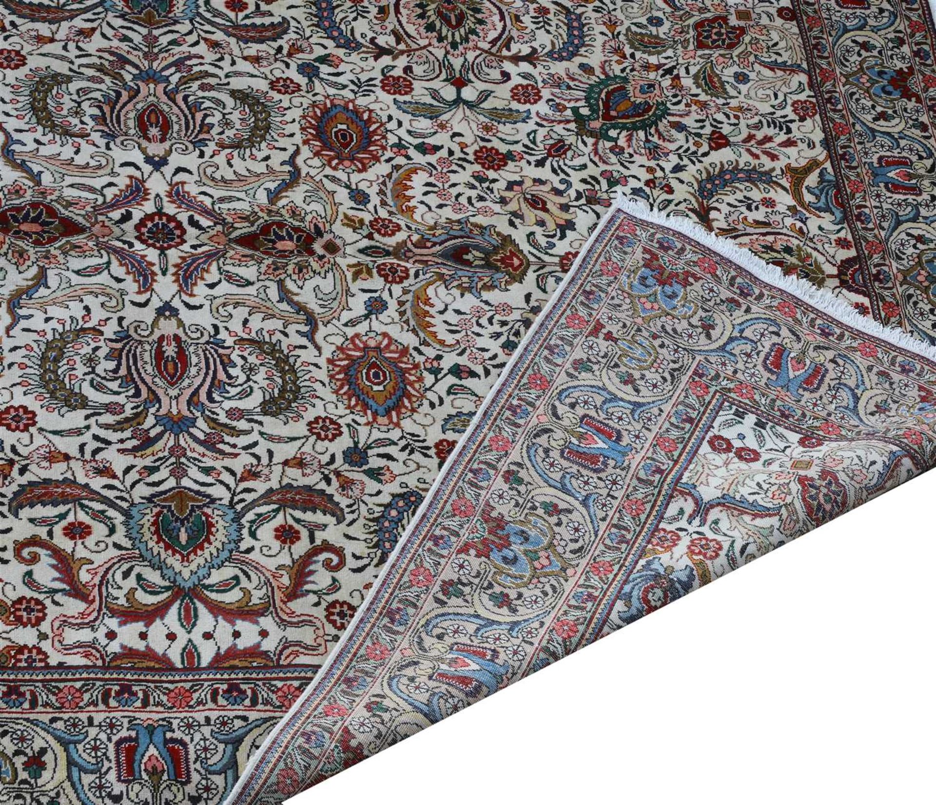 A large Persian Tabriz carpet