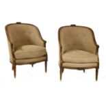 A pair of French walnut fauteuil tub chairs,