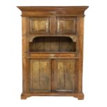 A large Continental pine and walnut cupboard,
