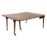 A George III mahogany, rosewood, crossbanded and satinwood strung metamorphic dining table,