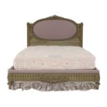 A French limed oak and upholstered double bed,