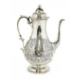 A silver coffee pot,