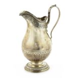 A German white metal cream jug,