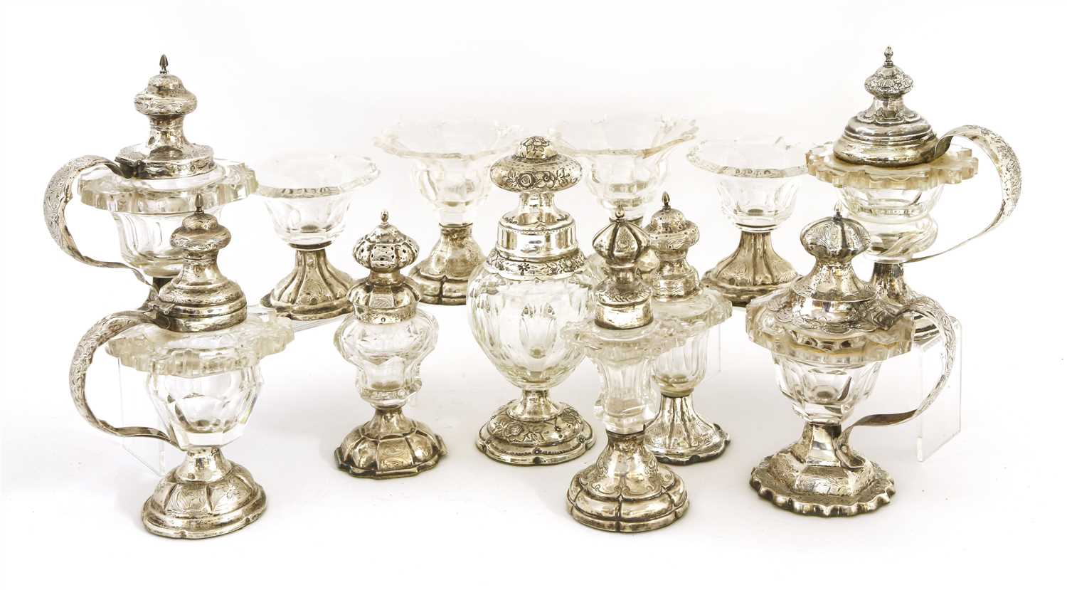 A matched set of twelve Dutch white metal and cut-glass condiments,