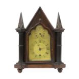 A Gothic Revival rosewood mantel clock by Perry Webster,