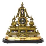 A French gilt bronze and black porcelain panel mantel clock,