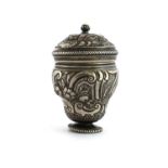 A silver nutmeg grater and cover,