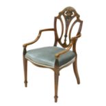 An Edwardian mahogany elbow chair,
