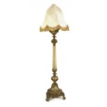 An unusual frosted glass and gilt standard oil lamp,