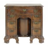 A George III-style mahogany kneehole desk,