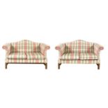 A pair of Kingcome walnut camel back settees,