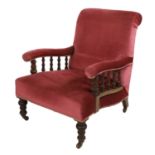 An Howard and Sons library armchair,