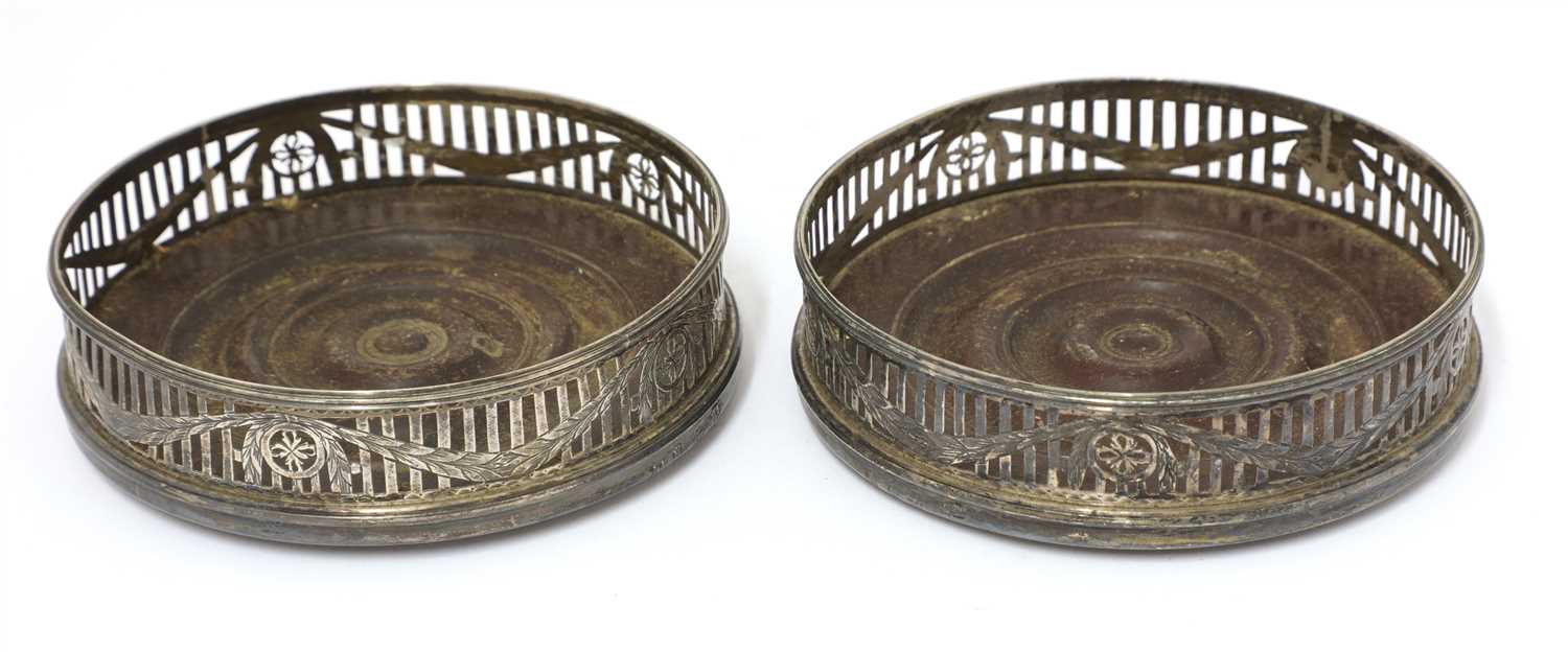 A pair of George III wine coasters,