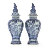 A pair of Dutch delft vases and covers,