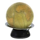 A small illuminated table globe,