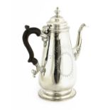 A silver coffee pot,