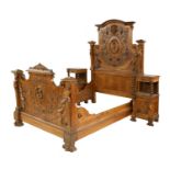 An elaborately carved French walnut bed,