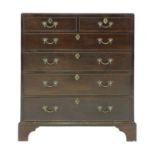 A George III walnut caddy top chest of four graduated long drawers,