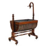 A Charles X mahogany rocking crib,