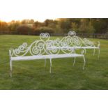 A pair of wrought iron Scottish-style benches,